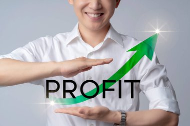 Closeup business asian man smile with hand gesture protect profit word text with green chart arrow rise up success ful business ideas concept grey background clipart
