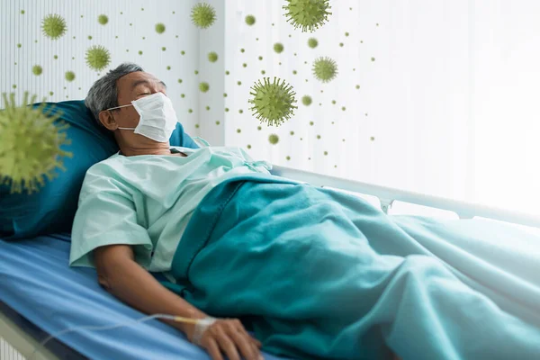 Asian patient senior man lying in hospital bed because of coronavirus infection, female doctor is giving medicine to a patient surround with covid-19 virus symbol health ideas concept