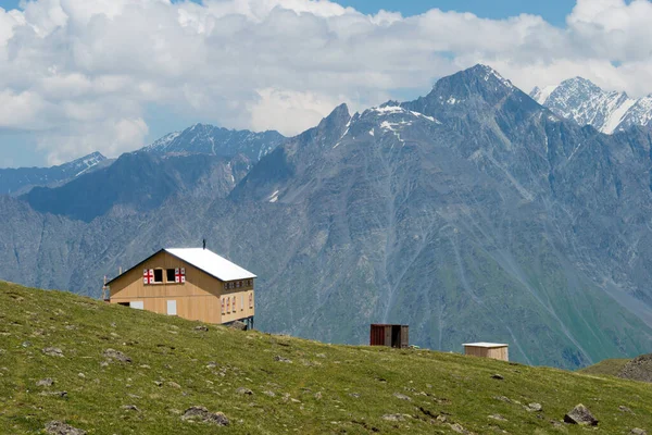 Kazbegi, Georgia - Mountain hut at Mountain range on a hiking trail from Gergeti Trinity Church to Gergeti Glacier in Kazbegi, Mtskheta-Mtianeti, Georgia.