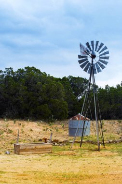 Windmill in Hill Country on Willow City Loop Road, Texas clipart