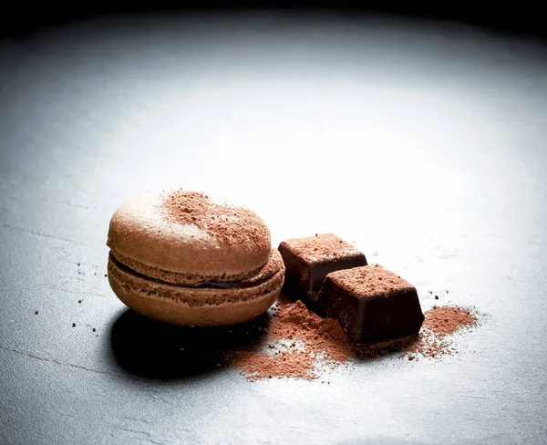 Chocolate macaron at the black background — Stock Photo, Image