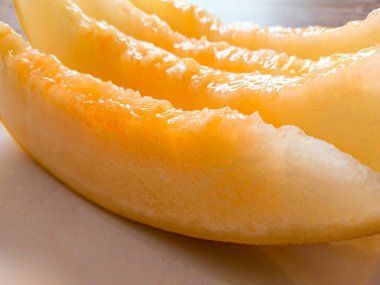 Arka plan olarak lezzetli bal kavun parçaları