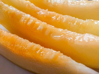 Arka plan olarak lezzetli bal kavun parçaları