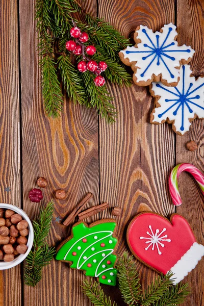 Top View Gingerbread Cookies Christmas Tree Branches Nuts Wooden Surface — Stock Photo, Image