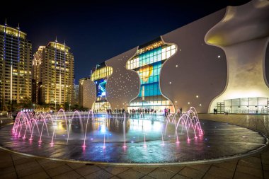 Taichung, Taiwan - Mar 10, 2018: The night view of the fountains show in front of the National Taichung Theater.  clipart