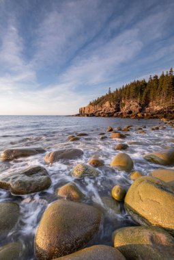 Sunrise along the rocky coast of Maine in Acadia National Park clipart