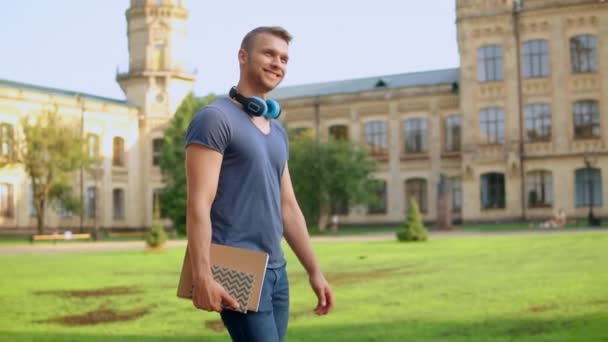 Handsome student walks sunny day — Stock Video