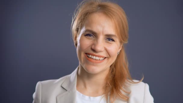 Charming Smiling Blond Posing in Studio on Blue Background — Stock Video