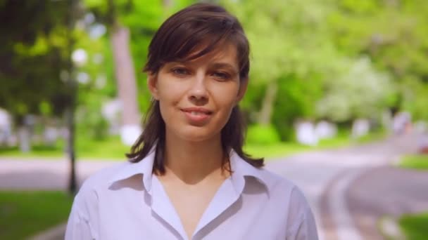 Close up portrait caucasian woman in park — Stock Video