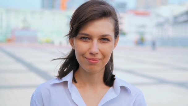 Close up young woman white casual shirt looking camera laughing — Stock Video