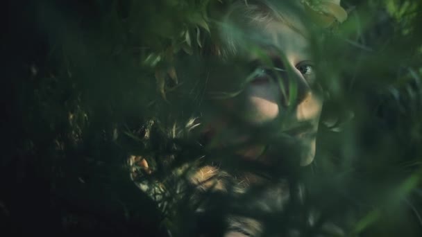 Portrait of mystical girl in the woods hold a ritual. She dressed in long dresses with wreath on the head. Witches, esoteric sessions, magic, divination, otherworldly forces — Stock Video