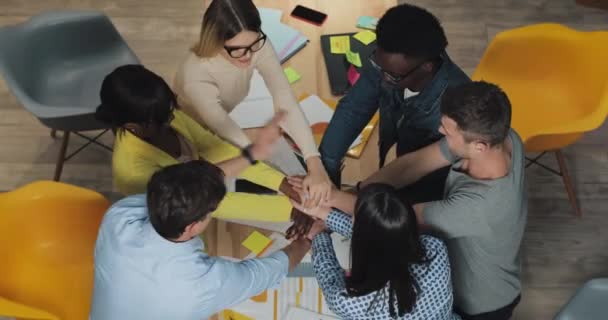 Multi-ethnic business people sticking their hands together in office. Success business , start-up, teamwork concept. — Stock Video