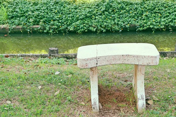 Stone chair in park