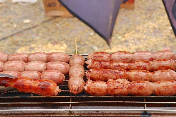 Grilled sausages at street food — Stock Photo, Image