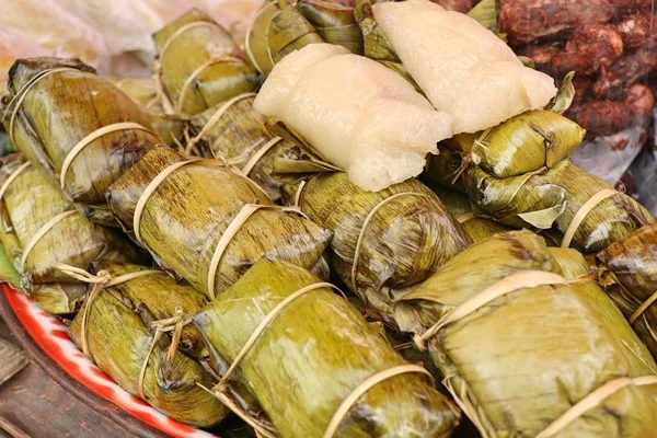 Sticky rice wrapped in banana leaves — Stock Photo, Image