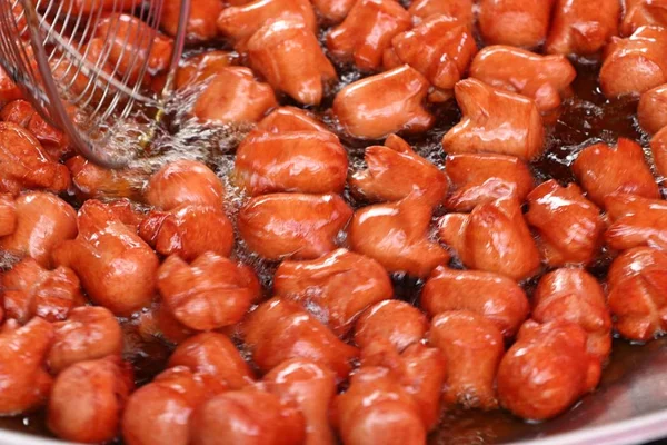 Fried sausage at street food — Stock Photo, Image