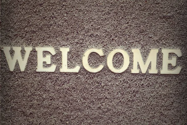 Background carpet sign in welcome — Stock Photo, Image