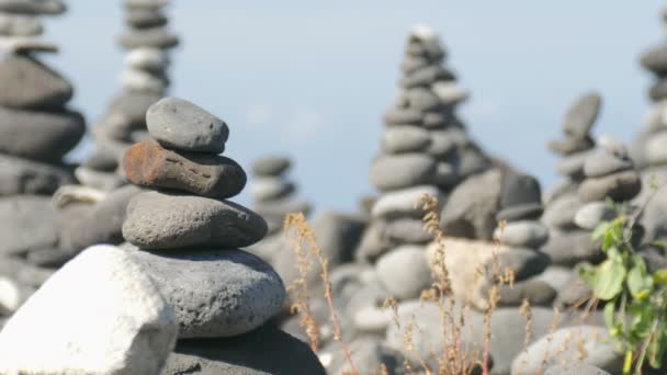 Many Stacked Cairns Coast — Stock Video