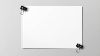 Siyah gri arka plan üzerinde beyaz kağıda izole ataş.