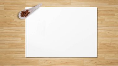 Yıldız anason tahta kaşıklar ahşap arka plan üzerinde beyaz kağıda izole içinde