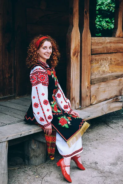 Young Slavonic Woman Traditional Embroidered Costume Red Shoes Sitting Porch — Stock Photo, Image