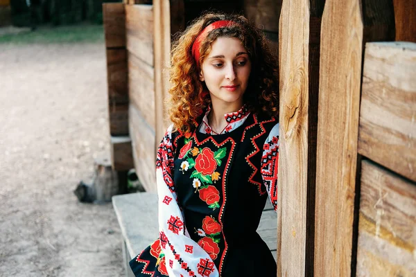 Young Slavonic Woman Traditional Embroidered Costume Red Shoes Sitting Porch — Stock Photo, Image