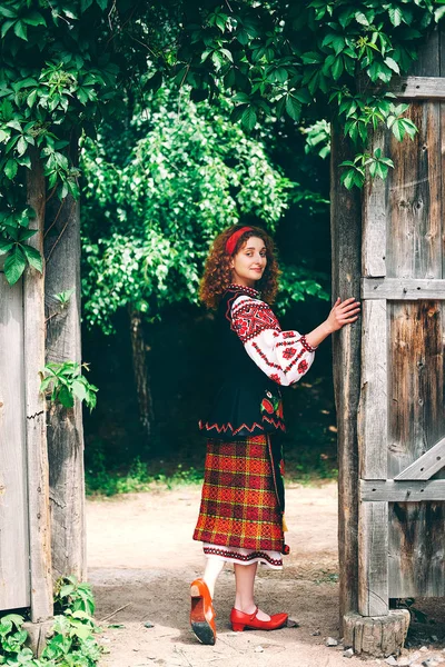 Young Slavonic Woman Traditional Embroidered Costume Red Shoes Sitting Porch — Stock Photo, Image