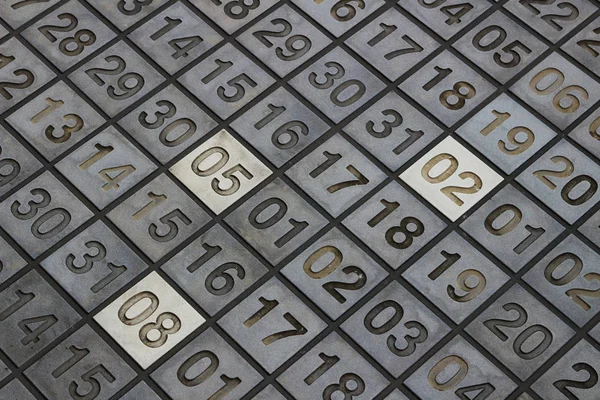 Block floor with numbers engraved