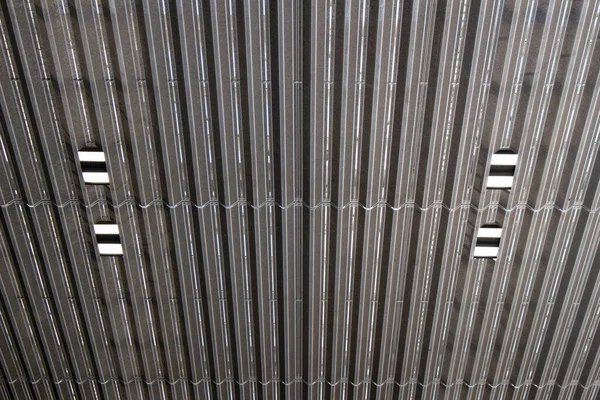 Ceiling design with metal grid plates