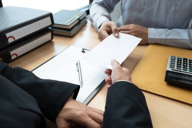 Boss received a letter of resignation from employee on the table