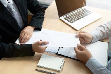 Boss received a letter of resignation from employee on the table