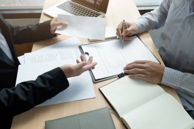 Boss sending a resignation letter to the employee on the table i