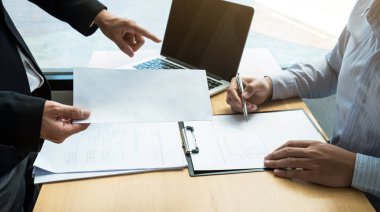 Boss sending a resignation letter to the employee on the table i