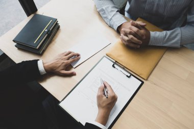 Boss sending a resignation letter to the employee on the table i