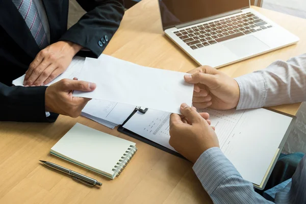 Boss received a letter of resignation from employee on the table