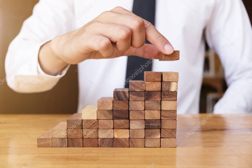 The way planning for business growth with wooden blocks