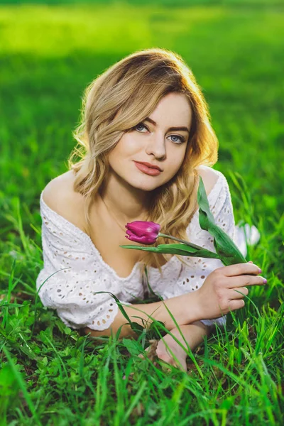 Young Beautiful Blonde Girl White Dress Flower Tulip Background Green — Stock Photo, Image