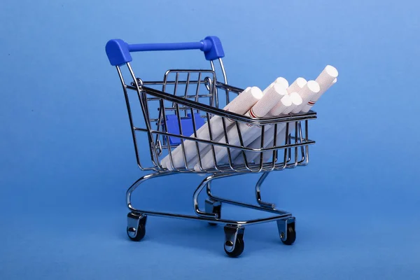 Smoking Concept Cigarettes Shopping Cart Shopping Trolley Blue Background — Stock Photo, Image