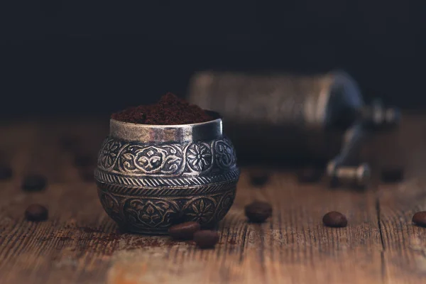 Fresh ground coffee in a vintage metal manual manual coffee grinder — Stock Photo, Image