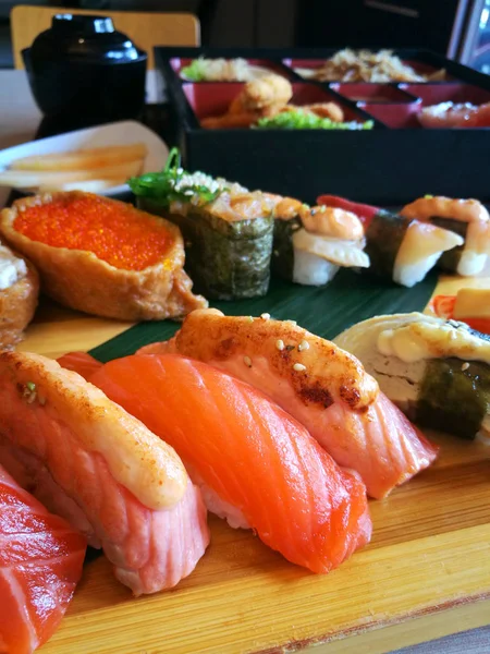 Sushi dish at japanese restaurant. Sushi is the most famous dishes in the Japanese cuisine.