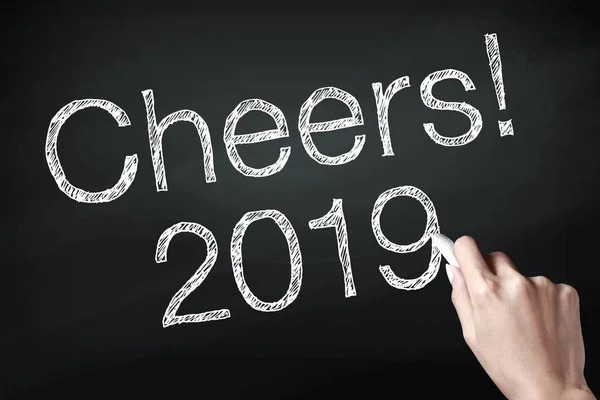 Cheers 2019 with hand. New year is the first day of the year in the Gregorian calendar.