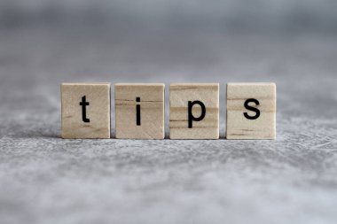 Tips word written on wood cube
