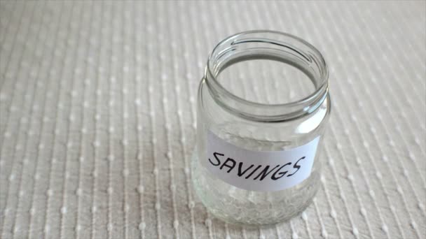Saving Jar Being Filled Coins — Stock video