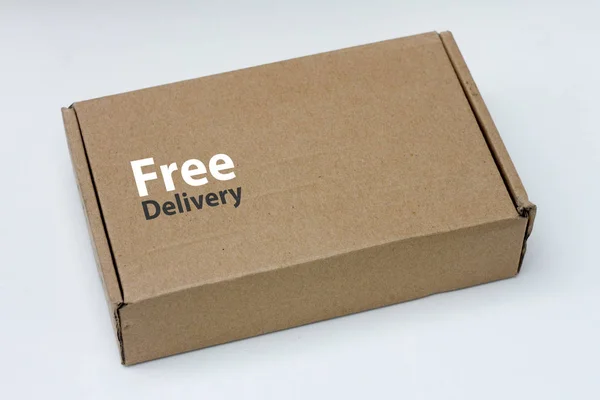 free delivery, business,online shopping, ecommerce and delivery service concept - brown box with note \