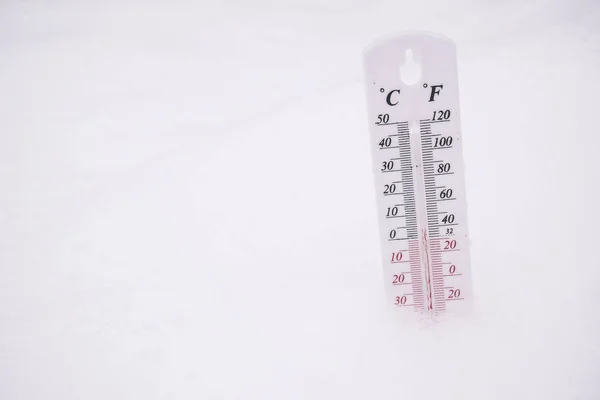 Thermometer in the snow Royalty Free Stock Photos