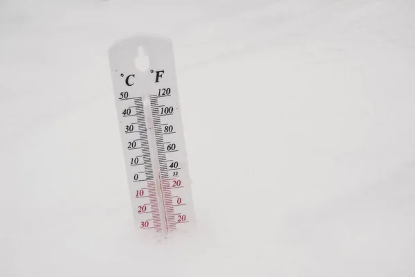 Thermometer in the snow Royalty Free Stock Images