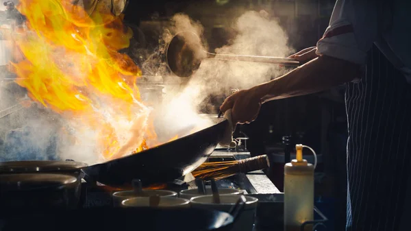 Chef stir fry in wok — Stock Photo, Image