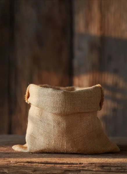 empty Sack Bag on wood background