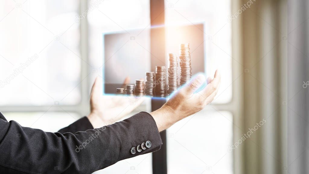 Business people look at the picture to analyze the investment market, Doubble exposure photo on hand