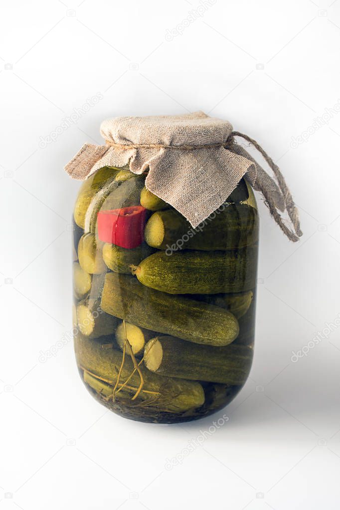 A can of canned cucumbers on a white background